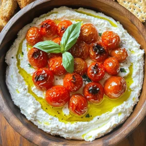 Here’s what you need for the whipped feta dip with roasted tomatoes: - 8 oz feta cheese, crumbled - 1/2 cup Greek yogurt - 2 tablespoons olive oil - 1 teaspoon lemon juice - 1 teaspoon dried oregano - 1/2 teaspoon garlic powder - 1 cup cherry tomatoes, halved - Salt and pepper to taste - Fresh basil leaves for garnish - Crusty bread or crackers for serving Each ingredient plays a key role in this dip. The feta cheese gives it a tangy flavor. Greek yogurt adds creaminess and a bit of tang. Olive oil adds richness, while lemon juice brightens the mix. Dried oregano provides a lovely herb taste. Garlic powder adds depth to the flavor. The cherry tomatoes add sweetness and a pop of color. Salt and pepper enhance all the flavors. Fresh basil leaves give a fresh touch at the end. Finally, crusty bread or crackers serve as the perfect vehicle for the dip. Enjoy the mix of textures and flavors! Preheating the Oven Start by preheating your oven to 400°F (200°C). This step is key for roasting tomatoes. Roasting the Tomatoes In a bowl, mix halved cherry tomatoes with 1 tablespoon of olive oil, salt, and pepper. Toss them well to coat. Spread the tomatoes on a baking sheet. Roast for 15 to 20 minutes. They should be soft and slightly caramelized when done. Making the Whipped Feta While the tomatoes roast, prepare the whipped feta. In a food processor, add crumbled feta, Greek yogurt, 1 tablespoon olive oil, lemon juice, dried oregano, garlic powder, and a pinch of salt and pepper. Blend until it becomes smooth and creamy. Scrape the sides as needed. Taste the mixture and adjust seasoning if you want. Combining Ingredients After the tomatoes cool a bit, gently fold them into the whipped feta. Reserve some tomatoes for garnish. This mix combines creamy and savory flavors. Final Touches Transfer the dip to a serving bowl. Top with the reserved roasted tomatoes and drizzle a bit of olive oil over it. Garnish with fresh basil leaves for added color and flavor. Now, your whipped feta dip is ready to serve! - Best Types of Feta: Use a good quality feta cheese. Look for the creamy kind packed in brine. This type gives the dip a rich flavor and smooth texture. Avoid crumbled feta. It often lacks the moisture needed for creaminess. - How to Store Leftovers: If you have extra dip, store it in an airtight container. It keeps well in the fridge for up to 3 days. To prevent drying out, cover the surface with a thin layer of olive oil. This keeps it fresh and tasty. - Adjusting Consistency: If your dip is too thick, add a splash of olive oil or more Greek yogurt. Blend until smooth. If it's too thin, add a little more feta to thicken it. Adjust to your liking for the perfect texture. - Ideal Pairing Options: This dip pairs great with crusty bread, crackers, or pita chips. You can also serve it with fresh veggies like cucumber or bell peppers for a healthy twist. Try adding marinated olives for an extra flavor kick. - Plating and Presentation Tips: Serve the dip in a rustic bowl for a cozy look. Drizzle extra olive oil on top. Add the reserved roasted tomatoes as a colorful garnish. Finish with fresh basil leaves for a bright touch. This makes your dish look as good as it tastes! {{image_2}} - Dairy-Free Alternatives: If you want a dairy-free dip, use a plant-based feta. You can also use cashew cream for a creamy texture. Coconut yogurt is a good swap for Greek yogurt. - Flavor Enhancements: To boost flavor, try adding a bit of smoked paprika. You can also mix in some sun-dried tomatoes or olives for a different taste. - Adding Spices: Spice up your dip by adding crushed red pepper flakes. You could also stir in a bit of cumin for warmth. Don't be afraid to experiment with spices you love! - Incorporating Other Vegetables: Try mixing in roasted red peppers or artichoke hearts. Fresh spinach or arugula can add a nice crunch and color. Get creative with what you have on hand! Refrigerator Storage Store your whipped feta dip in an airtight container. It stays fresh for about 3 to 5 days. Make sure to press plastic wrap directly onto the dip to keep it moist. This will help keep the flavors intact. Freezing Tips You can freeze the dip, but the texture may change. Use a freezer-safe container and leave some space at the top. This allows for expansion. When ready to eat, thaw it in the fridge overnight. Re-blend it if needed to restore creaminess. Duration of Freshness The dip is best when fresh. In the fridge, it lasts about 3 to 5 days. If frozen, aim to use it within 2 to 3 months for the best taste. Signs of Spoilage Watch for changes in smell, color, or texture. If it smells sour or looks discolored, it’s best to toss it. Always trust your senses. If in doubt, throw it out! Can I make this dip ahead of time? Yes, you can make this dip a day before. Just store it in the fridge. The flavors blend well overnight, making it taste even better. Before serving, give it a quick stir and taste for seasoning. What can I substitute for Greek yogurt? If you don't have Greek yogurt, try sour cream or plain yogurt. Both will add creaminess. You can also use a dairy-free yogurt if you prefer a vegan option. How can I enhance the flavor profile? Adding fresh herbs like chives or dill can boost the taste. You can also mix in a pinch of red pepper flakes for heat. A drizzle of balsamic glaze on top adds sweetness and brightness. Health Benefits of Ingredients - Feta cheese provides protein and calcium. - Greek yogurt adds probiotics, aiding digestion. - Olive oil offers healthy fats, supporting heart health. - Tomatoes are rich in vitamins and antioxidants. Caloric Breakdown per Serving One serving has about 120 calories. This includes calories from feta cheese, yogurt, and olive oil. The roasted tomatoes add minimal calories but bring great flavor and nutrients. In this post, we covered how to make a delicious whipped feta dip. We discussed the key ingredients like feta cheese, Greek yogurt, and cherry tomatoes. I shared step-by-step instructions for roasting and combining these flavors, plus tips to make it perfect. You can customize your dip easily and store leftovers well. This fun recipe suits any gathering and will impress your friends. Try it out, and enjoy the tasty results!