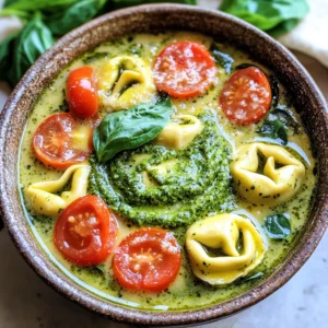 To make creamy pesto tortellini soup, gather these ingredients: - 1 tablespoon olive oil - 1 small onion, diced - 3 cloves garlic, minced - 4 cups vegetable broth - 2 cups heavy cream - 1 cup basil pesto (store-bought or homemade) - 2 cups cheese tortellini (fresh or frozen) - 1 cup cherry tomatoes, halved - 1 cup baby spinach - Salt and pepper to taste - Fresh basil leaves for garnishing - Grated Parmesan cheese for topping You can swap ingredients to suit your taste. Use chicken broth instead of vegetable broth for more flavor. If you want a lighter soup, replace heavy cream with half-and-half or coconut milk. You can also use any type of pesto, like sun-dried tomato or arugula pesto. If you prefer gluten-free options, choose gluten-free tortellini. Garnishing makes the soup look and taste better. Fresh basil leaves add a nice touch. Grated Parmesan cheese gives it a salty flavor. You can also add a drizzle of olive oil for extra richness. To spice it up, try red pepper flakes. - Start by gathering all your ingredients. - Dice one small onion. - Mince three cloves of garlic. - Halve one cup of cherry tomatoes. - Measure out the cheese tortellini, spinach, and pesto. 1. Heat one tablespoon of olive oil in a large pot over medium heat. 2. Add the diced onion and cook for about five minutes. You want it translucent. 3. Add the minced garlic and cook for one more minute. The aroma will fill your kitchen. 4. Pour in four cups of vegetable broth. Bring it to a simmer. 5. Stir in two cups of heavy cream and one cup of basil pesto. Mix well. 6. Add the cheese tortellini and simmer. This takes about five to seven minutes. They float when they are done. 7. Gently stir in the halved cherry tomatoes and one cup of baby spinach. Cook for two to three minutes. You want the spinach to wilt. 8. Season with salt and pepper to taste. - The tortellini should float to the top of the soup. - Spinach wilts and changes color to a bright green. - The soup should be creamy and warm throughout. - Look for the tomatoes to soften but not fall apart. To boost the taste of your creamy pesto tortellini soup, use fresh ingredients. Fresh garlic gives a strong kick. You can also try adding a squeeze of lemon juice. This adds brightness and balances the creaminess. If you love spice, add red pepper flakes while cooking. Fresh herbs like parsley or thyme can also enhance the dish. One common mistake is cooking the tortellini for too long. Overcooking makes them mushy. Make sure to check them when they float. Another mistake is not seasoning enough. Taste the soup before serving and adjust salt and pepper. Avoid adding the spinach too early; it should wilt just before serving. For this recipe, you need a large pot to cook everything. A wooden spoon is great for mixing. A sharp knife helps you chop the onion and garlic. A cutting board keeps your area tidy. Lastly, having measuring cups ensures you get the right amounts of broth and cream. {{image_2}} You can add protein to make this soup heartier. Cooked chicken or shrimp works well. Just toss it in during the last few minutes of cooking. If you prefer meat, try diced sausage or bacon. They add a nice flavor. For a simple option, use canned beans like chickpeas or white beans. They are tasty and filling. To make this soup vegan or dairy-free, swap the heavy cream for coconut milk. It gives a creamy feel without dairy. Use vegetable broth to keep it plant-based. Choose vegan tortellini, which you can find in stores. Make sure the pesto is dairy-free too. You can blend basil, nuts, nutritional yeast, and olive oil for a great vegan pesto. Feel free to customize ingredients based on your taste. You can add different veggies like zucchini or bell peppers. Just chop them small and toss them in with the onions. If you like heat, add red pepper flakes or a splash of hot sauce. For a fresh twist, squeeze some lemon juice right before serving. This adds a bright flavor that lifts the soup. After enjoying the creamy pesto tortellini soup, let it cool. Then, transfer it to an airtight container. Store it in the fridge for up to three days. Make sure the container is sealed well to keep the soup fresh. When you’re ready to enjoy it again, just take it out and check for any signs of spoilage. To freeze this soup, let it cool completely first. Pour the soup into freezer-safe containers or bags. Leave some space at the top of the container, as the soup will expand when frozen. You can freeze it for up to three months. When you want to eat it, just take it out and thaw it in the fridge overnight. Reheating creamy pesto tortellini soup is easy. You can use the stove or the microwave. If using the stove, pour the soup into a pot and heat it on low, stirring often. For the microwave, place the soup in a microwave-safe bowl. Heat it for 1-2 minutes, stirring halfway through. Always check that it is hot all the way through before serving. Yes, you can use frozen tortellini in this recipe. Just add it straight to the pot during cooking. Frozen tortellini cooks quickly, usually within 5 to 7 minutes. Check the package for exact times. They will float when done, just like fresh ones. To lighten up this soup, swap heavy cream for half-and-half or use a plant-based milk. You can also cut back on oil or use less pesto. Adding more veggies like zucchini or bell peppers can boost nutrition without adding heaviness. This soup pairs well with crusty bread or a fresh salad. A simple green salad with lemon dressing is a great choice. You might also enjoy it with garlic bread for extra flavor. For a fun twist, try adding a side of roasted vegetables. This article covered all you need to know for making creamy pesto tortellini soup. We discussed the key ingredients, substitutions, and garnishes that can make your dish shine. I shared step-by-step instructions along with tips to avoid common mistakes. We also explored variations and how to store leftovers properly. Remember, your choices can transform this soup into a personal favorite. Get creative with flavors and enjoy every bowl you serve!