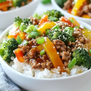 - 1 lb ground turkey - 2 tablespoons teriyaki sauce - 1 tablespoon soy sauce - 1 cup broccoli florets - 1 bell pepper - 2 green onions - 1 tablespoon sesame oil - 1 tablespoon fresh ginger, grated - 2 garlic cloves, minced - 1 cup cooked jasmine or brown rice Ground turkey is a lean choice. It cooks quickly and absorbs flavors well. Teriyaki sauce adds a sweet and savory kick. Low-sodium versions help keep the meal healthier. Soy sauce brings extra umami flavor to the mix. For vegetables, broccoli florets add crunch and nutrients. Bell pepper adds color and sweetness. Green onions offer a fresh, mild onion flavor. The sesame oil gives a rich, nutty taste. Fresh ginger adds zest. Minced garlic gives a nice aroma and depth. Finally, rice serves as a filling base. You can use jasmine or brown rice based on your preference. These ingredients work together to create a quick meal that is both tasty and healthy. {{ingredient_image_1}} - Heating the skillet: Start by placing a large skillet on medium heat. Pour in 1 tablespoon of sesame oil and let it warm up. This oil adds a rich flavor. - Adding garlic and ginger: Next, add 2 minced garlic cloves and 1 tablespoon of grated fresh ginger. Saut&eacute; for about 1 minute. You want them to release their wonderful aroma. - Incorporating broccoli and bell pepper: Now, add 1 cup of broccoli florets and 1 diced bell pepper to the skillet. You can use red or yellow for extra sweetness. - Cooking times for vegetables: Stir these veggies well and cook for 3-4 minutes. Aim for tenderness while keeping a nice crunch. - Adding teriyaki and soy sauce: Pour in 2 tablespoons of teriyaki sauce and 1 tablespoon of low-sodium soy sauce. Mix everything well to coat the turkey and vegetables. - Simmering for flavor: Allow the mixture to simmer for about 2 minutes. This step helps the flavors blend beautifully. - Choosing the right turkey: Select lean ground turkey for a lighter dish. Look for 93% lean or higher to keep it healthy and tasty. - Cooking tips for tenderness: Avoid overcooking the turkey. Cook it just until no pink remains. This keeps it juicy and tender. - Adjusting sauce quantities: If you like more flavor, increase the teriyaki sauce. Just a little more can bring out the taste. - Adding spice for heat: Want it spicy? Add red pepper flakes or sriracha. Start with a small amount and adjust to your liking. - Serving suggestions: Serve the turkey mixture over rice in a bowl. This creates a nice layer for a colorful dish. - Garnishing techniques: Top with green onions and sesame seeds. This adds crunch and a pop of flavor. You can also add a slice of lime for a fresh touch. Pro Tips Use Fresh Ingredients: Always opt for fresh garlic and ginger to enhance the flavors of your dish. Fresh ingredients provide more aroma and taste compared to dried alternatives. Customize Your Veggies: Feel free to substitute or add any vegetables you like. Carrots, snap peas, or mushrooms would also work well in this dish, adding color and texture. Adjust the Sauce: If you prefer a thicker sauce, consider mixing a teaspoon of cornstarch with water and adding it to the skillet before serving. This will create a glaze-like consistency. Meal Prep Friendly: This dish is great for meal prepping! Make a larger batch and store in the fridge for up to 4 days. Just reheat when ready to enjoy. {{image_2}} You can switch ground turkey for ground chicken. Ground chicken has a similar taste and texture. It cooks just as quickly and works well with teriyaki sauce. If you want a plant-based option, try tofu. Tofu soaks up flavors well. Press and cube it, then saut&eacute; it like the turkey. Feel free to mix in other vegetables. Snap peas, carrots, or zucchini all taste great. Seasonal variations can keep your dish fresh. In summer, add bell peppers and corn. In winter, try Brussels sprouts or kale for a hearty meal. Jasmine rice is soft and fragrant, perfect for this dish. Brown rice adds more fiber and a nutty taste. For a low-carb choice, use cauliflower rice. It&rsquo;s light and absorbs the sauce well. Each option lets you customize your meal to fit your diet. To keep your Ground Turkey Teriyaki Bowls fresh, use proper storage containers. Glass or BPA-free plastic containers work well. Allow the dish to cool down before sealing. This helps prevent moisture build-up. Stored correctly, the bowls last for 3 to 4 days in the fridge. You can freeze portions for later meals. Divide the bowls into individual servings. Use airtight containers or freezer bags. Remove as much air as possible. For best quality, consume within 2 to 3 months. When ready to eat, thaw in the fridge overnight. Reheat in the microwave or on the stove until hot. Prepare your Ground Turkey Teriyaki Bowls in advance for quick meals. Cook the turkey and veggies ahead of time. Store them separately from the rice. This keeps everything fresh. For quick reheating, microwave for 2 to 3 minutes. Stir halfway through to heat evenly. Enjoy a tasty meal without the wait! Yes, you can use store-bought teriyaki sauce. It saves time and effort. Many brands offer tasty options. However, homemade teriyaki sauce gives you better control over the flavors. You can adjust sweetness and saltiness. Making it at home adds a personal touch to your meal. This recipe can be gluten-free! Just choose gluten-free soy sauce. There are many brands available. Also, check your teriyaki sauce for gluten. Many brands now offer gluten-free versions. If you use these sauces, you can enjoy this dish without worry. To add heat to your turkey teriyaki bowls, use crushed red pepper flakes. You can also add sliced jalape&ntilde;os for a fresh kick. Another option is to mix in sriracha or chili paste. Start with a little, then taste and adjust. Spicing it up can make your meal even more exciting! This blog post covered a delicious ground turkey teriyaki bowl recipe. We discussed key ingredients like turkey, teriyaki sauce, and fresh veggies. I gave you simple steps for cooking and tips for boosting flavor. You also learned about storage and meal prep to save time. In closing, this dish is easy to make and adaptable. Try different proteins and veggies to suit your taste. With these ideas, enjoy making quick, healthy meals!