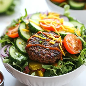 To make your burger bowls, gather these key items: - 1 pound ground beef or plant-based burger alternative - 1 teaspoon garlic powder - 1 teaspoon onion powder - 1 teaspoon smoked paprika - Salt and pepper to taste - 4 cups mixed greens (spinach, arugula, or romaine) - 1 cup cherry tomatoes, halved - 1 cucumber, diced - 1/2 red onion, thinly sliced - 1 avocado, sliced - 1/2 cup shredded cheddar cheese (or dairy-free cheese) - 1/4 cup pickles, sliced - 1/4 cup barbecue sauce or your favorite burger sauce These ingredients help build a flavorful and filling meal. The ground beef or plant-based option serves as the heart of the dish. The spices add depth, while the greens and veggies create a fresh base. Feel free to get creative with your toppings! Here are some ideas: - Sliced jalape&ntilde;os for heat - Crispy bacon bits for crunch - Sour cream for creaminess - Ranch or garlic sauce for extra flavor These toppings allow you to customize your bowl. Each addition brings a unique taste and texture to your meal. If you prefer plant-based options, substitute the ground beef with a veggie burger or lentils. For cheese, use a dairy-free version made from nuts or soy. These swaps make the dish suitable for various diets. They still deliver on flavor and satisfaction. These ingredient choices ensure that anyone can enjoy a delicious burger bowl, regardless of dietary needs. {{ingredient_image_1}} To start, grab a large bowl. Add the ground beef or your plant-based option. Then, mix in the garlic powder, onion powder, smoked paprika, salt, and pepper. Use your hands to blend everything well. Make sure the seasonings coat the meat evenly. This step adds flavor to each bite. Now, form the mixture into patties. You can make about 4 to 6, depending on how big you want them. Next, get your skillet ready. Preheat it over medium-high heat. Once hot, place the patties in the skillet. Cook them for 4 to 5 minutes on each side. You want them browned and fully cooked through. To check if they are done, cut one open. It should not be pink inside. After cooking, take the patties out and let them rest for a minute. This helps keep them juicy. Then, chop the patties into bite-sized pieces. Now it&rsquo;s time to build your burger bowls. Start with a base of mixed greens. You can use spinach, arugula, or romaine. Divide the greens into large bowls. Next, add the chopped burger patties on top of the greens. Now, layer on the cherry tomatoes, cucumber, red onion, and avocado slices. Don&rsquo;t forget to sprinkle the shredded cheese and pickles over the top. Finally, drizzle your favorite barbecue sauce or burger sauce over everything. Serve your bowls right away. Let everyone mix their bowls to match their taste. Enjoy this fun and tasty meal! To cook beef or plant-based patties, start with quality meat or alternatives. Use a mix of garlic powder, onion powder, and smoked paprika for flavor. Form your patties evenly to ensure they cook well. Heat your skillet to medium-high before adding patties. Cook them for 4-5 minutes on each side. Look for a nice brown crust. For plant-based patties, follow the same cooking time, but check package instructions. Let the patties rest for a minute before chopping them into bite-sized pieces for your bowls. Fresh ingredients make your burger bowls shine. Use leafy greens like spinach or romaine for crunch. Choose ripe cherry tomatoes and firm cucumbers for flavor. Thinly slice red onions for a crisp bite. Avocados should be ripe but not too soft. Shredded cheese adds richness, so pick your favorite. When selecting pickles, look for ones with a nice crunch. Always wash your veggies before use to remove dirt and pesticides. Fresh ingredients make every bite taste better. When serving burger bowls to guests, let them customize their own. Set out toppings in small bowls so everyone can choose. Include options like extra cheese, more veggies, or different sauces. A drizzle of barbecue sauce or a special burger sauce enhances the flavor. Offer a side of baked sweet potato fries for a fun touch. Encourage guests to mix their bowls for a unique taste experience. This interactive style makes the meal more enjoyable and personal. Pro Tips Cooking Temperature: Ensure your skillet is adequately preheated to achieve a nice sear on the patties, enhancing flavor and texture. Resting Time: Let the cooked patties rest for a minute before chopping to retain juices, making them more flavorful and moist. Fresh Ingredients: Use fresh, ripe vegetables for the toppings to enhance the overall flavor and presentation of your burger bowls. Customizable Sauces: Experiment with different sauces or dressings to personalize each bowl, making it a fun and unique dining experience for everyone. {{image_2}} You can make a tasty burger bowl without meat. Use a plant-based burger instead. These options taste great and are filling. Try black bean patties or lentil burgers. They add protein and fiber. You can also use chickpea patties for a unique twist. Add the same spices for flavor. If you follow a keto diet, skip the grains and sugars. Use lettuce as a base instead of mixed greens. You can use more cheese and avocado. These add healthy fats. For protein, select ground beef or turkey. Avoid barbecue sauce or select a low-carb option. This keeps your bowl flavorful and on track. Your burger bowl can be as unique as you are! Add any spices you love. Consider chili powder for heat or cumin for warmth. You can also swap veggies based on your favorites. Try bell peppers, radishes, or even roasted zucchini. Each bite can taste different! Let your creativity shine when building your bowl. You can store leftover burger bowls in the fridge. Use an airtight container to keep them fresh. It&rsquo;s best to eat them within three days. Make sure to keep the sauce separate. This helps the greens stay crisp. To reheat, you can use a microwave or a skillet. If using a microwave, place the bowl in for 1-2 minutes. Stir it halfway to heat evenly. If using a skillet, warm it over low heat for about 5 minutes. Add a splash of water if it feels dry. You can freeze burger patties for later use. Form the patties and place them on a baking sheet. Freeze them for about an hour until firm. Then, wrap each patty in plastic wrap and place them in a freezer bag. They can last up to three months. When ready to cook, thaw in the fridge overnight. A Burger Bowl is a fun and tasty meal. It combines burger ingredients in a bowl. Instead of a bun, you use greens. You can add your favorite toppings, like cheese and veggies. It&rsquo;s a great way to enjoy burgers in a new style. Yes, you can use frozen beef or alternative patties. Just make sure to thaw them first. Cook them as you would fresh patties. This saves time and still gives you yummy flavors. Burger Bowls can be healthy. They use fresh veggies and lean meat. You can control the toppings and sauces. This helps you make a meal that fits your needs. Plus, they are low in carbs if you skip the bun. Many sauces go well with Burger Bowls. Barbecue sauce is a popular choice. You can also try ranch dressing, ketchup, or mustard. Each sauce adds its own flavor, making every bowl unique. Burger bowls are fun and easy meals you can customize. We discussed main ingredients and toppings, plus tasty alternatives. You learned how to cook patties and assemble bowls step-by-step. Tips helped enhance flavor and freshness, while variations and storage ideas made it practical. Ultimately, burger bowls are healthy and suitable for everyone. Enjoy making them at home, and always try new ideas to keep it exciting. Your cooking will impress family and friends!