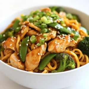 For a fantastic dish, gather these main ingredients: - 8 oz lo mein noodles - 1 lb boneless, skinless chicken breast, thinly sliced - 1 cup broccoli florets - 1 bell pepper, sliced (red or green) - 1 cup snap peas These ingredients form the backbone of your chicken lo mein. The lo mein noodles provide a chewy base. The chicken adds protein, while the veggies bring in color and crunch. Now, let's talk about the seasonings and oils that make this dish pop: - 3 tablespoons soy sauce - 2 tablespoons oyster sauce (or vegetarian substitute) - 1 tablespoon sesame oil - 3 cloves garlic, minced - 2 tablespoons ginger, minced These flavors meld together beautifully. Soy sauce gives that salty depth. Oyster sauce adds a sweet touch, while sesame oil offers a nutty aroma. Garlic and ginger provide warmth and spice, making the dish more aromatic. To finish off your chicken lo mein, consider these optional garnishes: - Green onions, chopped, for freshness - Suggestions for other toppings like sesame seeds or crushed peanuts Green onions add a crisp bite and a splash of color. Other toppings can enhance flavor and texture. Feel free to get creative! {{ingredient_image_1}} Start by filling a large pot with water. Bring the water to a boil over high heat. Once boiling, add 8 oz of lo mein noodles. Cook them according to the package instructions until they are al dente. This means they should be firm but not hard. After cooking, drain the noodles in a colander and set them aside. This step ensures the noodles have a nice texture. To cook the chicken perfectly, use a large skillet or wok. Heat 1 tablespoon of vegetable oil over medium-high heat. Add 1 lb of thinly sliced boneless, skinless chicken breast. Season it with salt and pepper. Cook the chicken for about 5-7 minutes. It should turn golden brown and be fully cooked. Once done, remove the chicken from the skillet and set it aside. This keeps it juicy and flavorful. In the same skillet, add 1 tablespoon of vegetable oil. Then, add 3 cloves of minced garlic and 2 tablespoons of minced ginger. Stir quickly to avoid burning. After that, toss in 1 cup of broccoli florets, sliced bell pepper, and 1 cup of snap peas. Stir-fry these for about 3-4 minutes. You want them to be tender-crisp, which means they should still have a little bite. This step keeps the veggies vibrant and fresh. Now it&rsquo;s time to bring everything together. Return the cooked chicken to the skillet with the veggies. Add the drained lo mein noodles. Pour in 3 tablespoons of soy sauce, 2 tablespoons of oyster sauce, and 1 tablespoon of sesame oil. Toss everything together well. Heat it through for about 2-3 minutes. This ensures all the flavors mix nicely. To serve, transfer the chicken lo mein to bowls. For a professional touch, garnish with chopped green onions. This adds color and freshness to your dish. Arrange everything nicely on the plate. A good presentation makes your meal more inviting. Enjoy your easy chicken lo mein! To keep your chicken lo mein tasty, avoid overcooking the chicken. Cook the chicken until golden, about 5-7 minutes. Use high heat for a quick cook. This keeps it juicy. When cooking the veggies, stir-fry them for 3-4 minutes. They should be tender but still crisp. This method locks in their flavor. You can easily make this dish vegetarian or vegan. Just swap the chicken for tofu or seitan. Use a vegetarian oyster sauce or skip it entirely. For noodles, you can use rice noodles or even zucchini noodles. These options fit different diets and still taste great. To store your lo mein, place it in an airtight container. Keep it in the fridge for up to three days. Reheat it in a pan over low heat. Add a splash of water or soy sauce to revive the flavors. You can also use the microwave, but keep an eye on it to avoid drying out. Pro Tips Prep Your Ingredients: Have all your ingredients prepped and ready to go before you start cooking. This makes the cooking process smoother and faster. High Heat for Stir-Frying: Use high heat when stir-frying to achieve that perfect char and quick cooking that keeps vegetables crisp. Customize Your Veggies: Feel free to swap in your favorite vegetables or whatever you have on hand to personalize the dish. Leftovers are Great: This dish stores well in the fridge and can be reheated for a quick meal the next day! {{image_2}} You can easily switch up the protein in your lo mein. Instead of chicken, try shrimp or tofu. Shrimp cooks fast and adds a nice flavor. Just saut&eacute; it until it turns pink. Tofu is a great choice for a vegetarian meal. Use firm tofu and press it to remove excess water. Then cut it into cubes and stir-fry until golden. These swaps keep your meal fun and fresh. Feel free to mix in different veggies based on what you like or what's in season. Carrots, bok choy, or mushrooms can add great taste and color. You can also use frozen mixed vegetables for a quick option. Just remember to cook them until crisp but tender. This way, you keep the crunch and the nutrients. Want to kick up the flavor? There are many ways to do this! Try adding hoisin sauce for a sweet twist. A bit of chili sauce can bring some heat. You can also sprinkle sesame seeds on top for extra crunch. Each sauce or spice will change the taste, making your meal unique every time. To keep your Easy Chicken Lo Mein fresh, store it in an airtight container. Place the container in the fridge if you plan to eat it in a few days. For long-term storage, use a freezer-safe container. This method preserves taste and texture. Leftovers can last in the fridge for about 3 to 4 days. In the freezer, they can stay good for up to 3 months. Mark the container with the date so you can track how long it has been stored. Always check for signs of spoilage before eating. For the best taste and texture, reheat your Chicken Lo Mein on the stove. Add a splash of water or soy sauce to keep it moist. Heat over medium heat until warm. You can also use the microwave but stir halfway through to ensure even warming. Enjoy your meal just as much as when it was freshly made! Making Easy Chicken Lo Mein takes about 25 minutes. This includes 10 minutes for prep and 15 minutes for cooking. You can easily fit this into a busy weeknight dinner. Yes, you can use gluten-free noodles. Look for rice noodles or other gluten-free options. Just cook them according to the package instructions. This way, everyone can enjoy the dish. You can try different sauces to change the flavor. Some good options are teriyaki sauce or hoisin sauce. You can also add a little chili sauce for some heat. Yes, you can make this dish ahead of time. Store it in an airtight container in the fridge for up to three days. To reheat, just warm it on the stove or in the microwave until hot. Easy Chicken Lo Mein is a simple dish packed with flavor. We covered main ingredients like noodles, chicken, and fresh vegetables. You learned about key seasonings and how to elevate the dish with garnishes. I gave you detailed instructions on cooking, combining, and presenting the meal. Plus, I shared helpful tips for variations, storage, and reheating. This dish is perfect for busy nights, offering flexibility and deliciousness. You can adapt it to fit your tastes and dietary needs. Enjoy making it your own!
