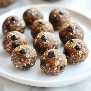 - 1 cup rolled oats - &frac12; cup natural peanut butter - &frac14; cup honey or maple syrup - &frac14; cup dark chocolate chips - 2 tablespoons chia seeds - 1 teaspoon vanilla extract - A pinch of salt For these energy balls, you need just a few simple items. Rolled oats give a nice base. Natural peanut butter adds creaminess and flavor. Honey or maple syrup serves as the sweetener. Dark chocolate chips bring a rich touch. Chia seeds add a bit of crunch and health benefits. Vanilla extract boosts the taste, while a pinch of salt balances everything out. - Calories per serving: About 120 calories - Macronutrients breakdown: 4g protein, 7g fat, 12g carbs Each energy ball packs a good punch of nutrition. With roughly 120 calories per ball, they offer a mix of protein, healthy fats, and carbs to keep you going. This balance makes them a great snack for any time of day. - About 1-2 energy balls per serving For the best experience, I suggest enjoying 1 to 2 energy balls at a time. This serving size gives you enough energy without overdoing it. These treats are perfect for a quick snack or a post-workout boost. {{ingredient_image_1}} 1. Mixing Ingredients Start by taking a mixing bowl. Add 1 cup of rolled oats, &frac12; cup of natural peanut butter, and &frac14; cup of honey or maple syrup. Then, pour in 1 teaspoon of vanilla extract. Stir all these together until they blend well. 2. Add the Extras Next, throw in &frac14; cup of dark chocolate chips, 2 tablespoons of chia seeds, and a pinch of salt. Mix everything until you see the chocolate and seeds spread out evenly. 3. Rolling the Energy Balls Grab a tablespoon and scoop out some of the mixture. Roll it in your hands to make a ball. If your hands get sticky, wet them lightly with water. This helps the mixture roll easier. 4. Chilling for Firmness Place the energy balls on a tray lined with parchment paper. Once done rolling, put the tray in the fridge. Let them chill for at least 30 minutes. This helps them firm up nicely. - Suggested Images I recommend taking photos of each key step. Capture the mixing, rolling, and finished energy balls. This visual guide will help you see what each stage should look like. - Tips for Easy Rolling If you find the mixture too sticky, remember to use damp hands. Keep your hands slightly wet as you roll to make the process smoother. - Sticky Mixtures If your mixture is too sticky, add a bit more rolled oats. This will help absorb the extra moisture and make rolling easier. - Adjusting Texture If you want a firmer texture, let the rolled balls chill a bit longer. You can also add more chia seeds to help thicken the mix. To make the best energy balls, start with high-quality ingredients. Use natural peanut butter without added sugar or oils. This choice keeps the flavor rich and the texture smooth. When it comes to sweetness, balance is key. If you find the mix too sweet, cut back on honey or maple syrup. Adding a pinch of salt can help enhance the flavors. For the best storage, keep your energy balls in an airtight container. They stay fresh in the fridge for up to one week. If you notice any odd smells or changes in texture, toss them out. This ensures you enjoy only the best snacks. These energy balls pair well with milk or your favorite plant-based drink. They make a great snack anytime, whether before or after a workout. Enjoy them as a quick breakfast or an afternoon treat. Pro Tips Use Old-Fashioned Oats: They provide a better texture and hold the energy balls together more effectively than instant oats. Experiment with Nut Butters: Try almond butter or cashew butter for a different flavor profile while still keeping it nutritious. Chill for Best Results: Refrigerating the energy balls not only helps them firm up but also enhances the flavors as they meld together. Make a Batch for Meal Prep: These energy balls are perfect for on-the-go snacks. Make a double batch and store them in the freezer for longer freshness. {{image_2}} You can make your energy balls even better with some simple changes. Adding spices like cinnamon or nutmeg gives a warm and cozy flavor. Just a pinch can elevate the taste. Try different nut butters too! Almond butter or cashew butter can change the whole vibe. Each nut butter adds a unique twist. If you need gluten-free options, use certified gluten-free oats. These oats keep the recipe safe for your diet. For vegan alternatives, swap honey with maple syrup. This will keep the sweetness while staying plant-based. You can enjoy your treat without worries. There are many fun add-ins to try! You can toss in seeds like pumpkin or sunflower seeds for extra crunch. Nuts add protein and flavor, so mix in some chopped almonds or walnuts. Dried fruits like raisins or cranberries can make your energy balls chewy and sweet. If you want a twist on chocolate, use white chocolate chips or carob chips instead. These options keep your snacks exciting and tasty. Store your Chocolate Peanut Butter Energy Balls in an airtight container. They stay fresh for up to one week in the fridge. Make sure to keep them sealed tight. This helps keep them tasty and prevents drying out. To freeze your energy balls, follow these steps: 1. Place the rolled energy balls on a tray. 2. Put the tray in the freezer for about 1-2 hours. 3. Once frozen, transfer the balls to a freezer-safe bag or container. 4. Label it with the date for easy tracking. When you want to eat them, thaw the balls in the fridge overnight. This way, they will keep their nice texture and flavor. For long-term storage, you can keep energy balls in the freezer. They last up to three months this way. Check for any off smells or changes in color. These are signs they have gone bad. Always trust your senses! Yes, you can! If you want to switch things up, try almond butter or cashew butter. Both will give a nice flavor. Just make sure you choose a nut butter that is smooth and has no added sugar. This will keep your energy balls tasty and healthy! These energy balls last up to one week in the fridge. Just store them in an airtight container to keep them fresh. If you want to keep them longer, you can freeze them. They will stay good for about three months in the freezer. Just let them thaw in the fridge before you eat them. Yes, making these energy balls ahead of time is a great idea! You can mix and roll them up to a week in advance. Just keep them in the fridge or freezer. This way, you have a quick snack ready when you need it. Meal prepping makes it easy to eat healthy! You now have all the ingredients and steps to make energy balls. This simple snack is healthy and easy to prepare. Remember to balance the flavors and choose quality ingredients. Store them properly to enjoy longer. Feel free to experiment with variations or add-ins to keep things exciting. These energy balls fit into any routine, whether you're at home or on the go. Now, it's your turn to roll up your sleeves and create a tasty snack! Enjoy every bite of your energy-giving treat.