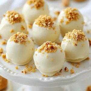 - 1 cup Biscoff cookie butter - 1 cup crushed Biscoff cookies (plus extra for rolling) - 1 cup white chocolate chips - 1 tablespoon coconut oil - A pinch of sea salt The main star of this recipe is the Biscoff cookie butter. It has a rich, sweet flavor that makes these truffles special. The crushed Biscoff cookies add a crunchy texture and deep taste. White chocolate chips provide a creamy coating that perfectly balances the flavors. Coconut oil helps the chocolate melt smoothly and adds a hint of tropical taste. A pinch of sea salt enhances all the sweet notes. - Chopped nuts (hazelnuts or almonds) - Additional toppings (e.g., extra crushed Biscoff cookies) If you want to add a bit more crunch, toss in some chopped nuts like hazelnuts or almonds. They bring a nice contrast to the soft truffles. Extra crushed Biscoff cookies work well as toppings too. They give a fun look and extra flavor. You can mix and match these add-ins to make your truffles unique and fun! {{ingredient_image_1}} Start by mixing the Biscoff cookie butter and crushed Biscoff cookies in a bowl. Use a spatula or spoon to combine them well. You want a firm dough that holds together easily. Once mixed, cover the bowl with plastic wrap and chill it in the fridge for about 30 minutes. This step is key. Chilling makes the mixture easier to shape into truffles later. After chilling, take the mixture out of the fridge. Use your hands to scoop small amounts of the mixture. Aim for about 1 inch in diameter for each ball. Roll the mixture in your palms until smooth. Place each ball on a baking sheet lined with parchment paper. This keeps them from sticking. Next, grab a microwave-safe bowl. Add the white chocolate chips and coconut oil to it. Microwave in 30-second bursts. Stir between each burst until smooth. This keeps the chocolate from burning. Once melted, dip each truffle into the chocolate. Let the excess chocolate drip off. You can roll the truffles in extra crushed Biscoff cookies or chopped nuts for a fun finish. After coating, place the truffles back on the parchment paper. Let them set at room temperature for about 15-20 minutes until hard. If you want to add a drizzle of white chocolate, melt some more and use a fork to create patterns on top. This adds a nice touch and makes the truffles look extra special. Chilling the dough is key for smooth truffles. When you chill the mixture for about 30 minutes, it firms up. This makes rolling easier and helps the truffles hold their shape. If you skip this step, your truffles may turn out too soft and hard to manage. The coating chocolate needs to be just right. When melting the white chocolate, mix in some coconut oil. This helps the chocolate stay smooth and shiny. If it gets too thick, it will not coat the truffles well. Aim for a nice, even coating that hugs each truffle. If your mixture feels dry or crumbly, add a bit more Biscoff cookie butter. Start with one tablespoon at a time until the texture improves. You want the mixture to hold together without falling apart. Sometimes, the chocolate hardens too quickly when coating the truffles. To fix this, melt the chocolate in smaller batches. Dip a few truffles, then reheat the chocolate briefly. This keeps it smooth and easy to work with. Arranging truffles can be fun and creative. Use a nice plate to show off your treats. You can stack them in groups or place them in small paper cups for a cute touch. For serving, consider pairing them with coffee or tea. The rich flavors of Biscoff and white chocolate go great with warm drinks. You can also add a simple garnish, like a sprinkle of crushed cookies, on top of each truffle for extra flair. Pro Tips Chill for Easier Rolling: Ensure the cookie mixture is chilled for at least 30 minutes to make rolling into truffles easier and less sticky. Quality Chocolate Matters: Use high-quality white chocolate for melting to achieve a smoother and creamier coating on the truffles. Customize Your Coating: Feel free to experiment with different toppings, such as crushed nuts, sprinkles, or even a drizzle of dark chocolate for added flavor. Store Properly: Keep the truffles in an airtight container in the refrigerator to maintain their shape and freshness for up to a week. {{image_2}} You can change the taste of your Biscoff cookie butter truffles easily. One fun idea is to use dark chocolate instead of white chocolate. Dark chocolate adds a rich taste that pairs well with the sweet cookie butter. If you want to get creative, try adding a few drops of flavor extracts like vanilla or almond. This small change can give your truffles a unique twist. For those with dietary needs, I have options. To make these truffles gluten-free, simply use gluten-free Biscoff cookies. This keeps the deliciousness while meeting gluten-free diets. If you need a vegan version, substitute white chocolate with vegan chocolate chips. You can also swap regular butter for a plant-based butter. These adjustments keep the truffles tasty and suitable for more diets. Toppings can make your truffles stand out. You might try rolling them in crushed nuts like hazelnuts or almonds for added crunch. Another idea is to mix in different cookie types. For example, you can use chocolate cookies or even graham crackers for a fun flavor blend. Feel free to experiment with various toppings to make each batch unique and exciting! To keep your Biscoff cookie butter truffles fresh, store them in the fridge. They taste best cold and stay firm. If you plan to eat them within a week, you can keep them at room temperature. Just make sure they are in a cool, dry place. - Refrigeration: Store in an airtight container. This keeps moisture away and helps the truffles last longer. - Room Temperature: Use a sealed container, away from heat. Check for any signs of melting chocolate. To maintain freshness, avoid stacking the truffles. This prevents them from sticking together. If you want to add a nice touch, place a piece of parchment paper between layers. Freezing your truffles is a great option if you want to save some for later. Make sure to pack them properly before freezing. - Proper Packing: Place the truffles in a single layer in an airtight container. You can also wrap each truffle in plastic wrap before putting them in the container. This protects them from freezer burn. - Thawing Tips: When you are ready to enjoy them, take the truffles out of the freezer. Let them sit in the fridge for several hours or overnight. This keeps their taste and texture nice. Avoid thawing them at room temperature to prevent melting. Shelf life at room temperature: Biscoff cookie butter truffles can last for about 2 days at room temperature. Keep them in a cool, dry place. Refrigerated shelf life: If you store them in the fridge, they can last up to 1 week. This helps the chocolate stay firm and fresh. Yes, you can use other types of cookie butter. Brands like Trader Joe's or Speculoos offer great flavors. You can also try flavors like gingerbread or chocolate cookie butter for a twist. To make these truffles nut-free, simply skip the nuts in the recipe. Use crushed Biscoff cookies for rolling instead. Check that any cookie butter you use is nut-free. Always read labels to avoid allergens. Biscoff Cookie Butter Truffles are easy and fun to make. We explored key ingredients, like Biscoff cookie butter and white chocolate, guiding you step-by-step from mixing to coating. I shared tips to achieve the best texture and troubleshoot common problems. Remember, you can customize these truffles with fun flavors and toppings. Store them properly for the best taste. Enjoy making these sweet treats! They&rsquo;re sure to impress anyone who tries them.